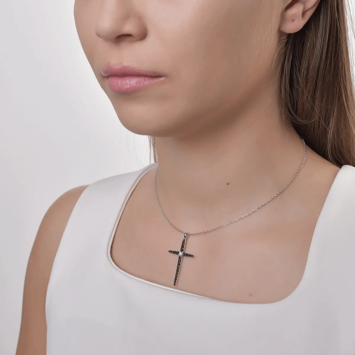 18K white gold cross pendant necklace with 1ct black diamonds and a 0.09ct clear diamond