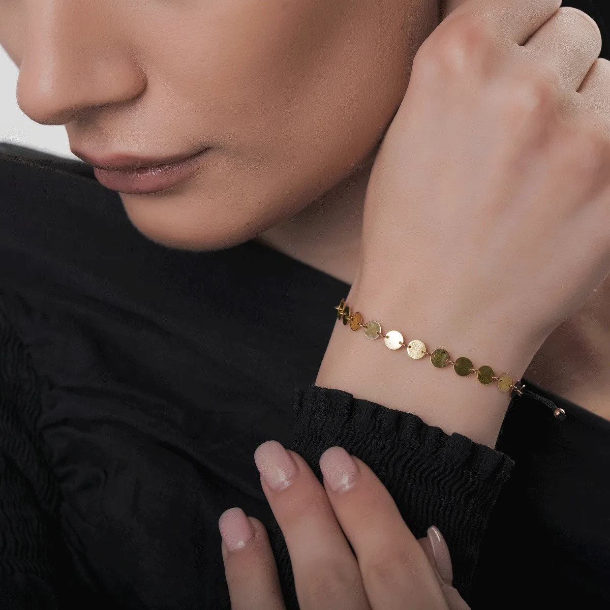 Black cord bracelet with 14K yellow gold