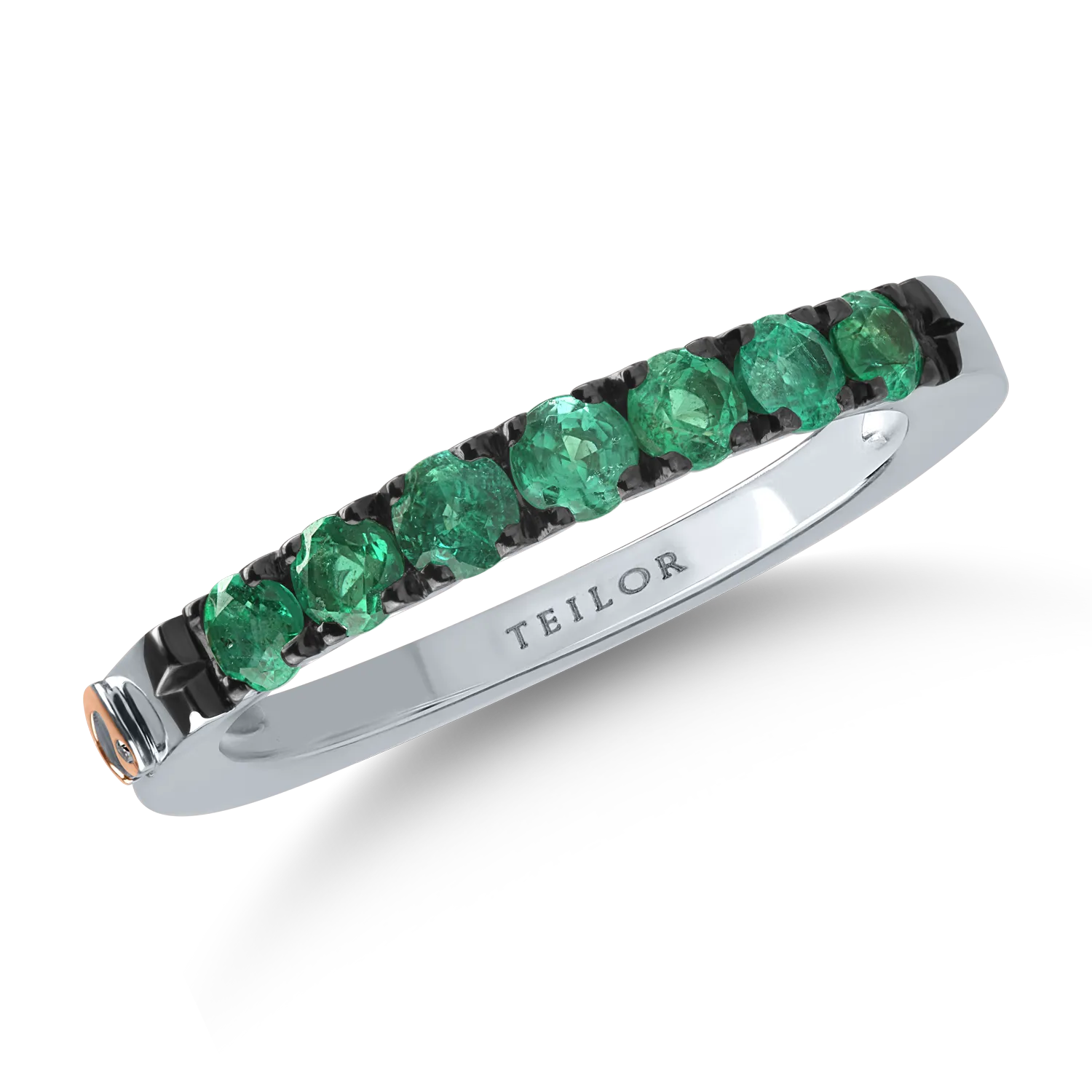 Half eternity ring in white gold with 0.6ct emeralds