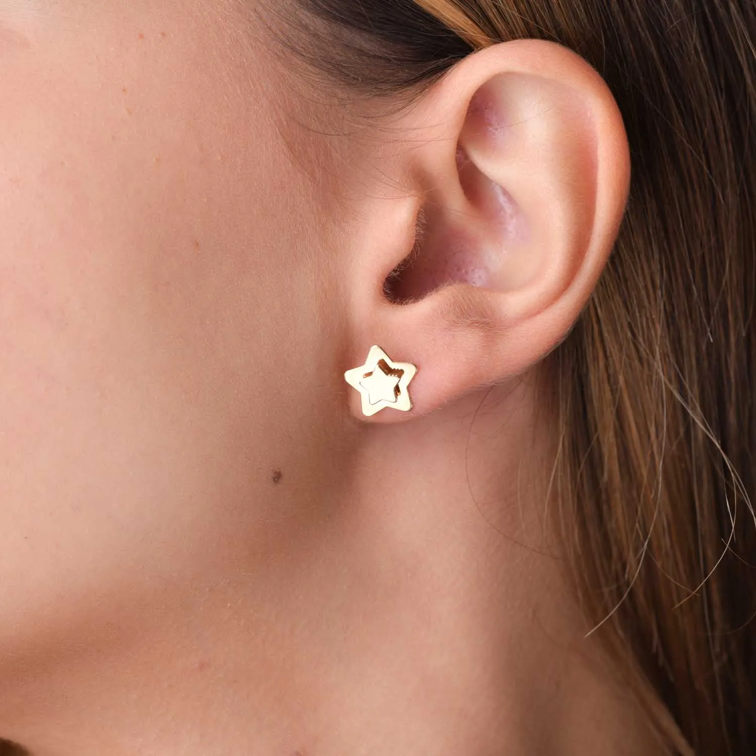 Yellow gold star earrings