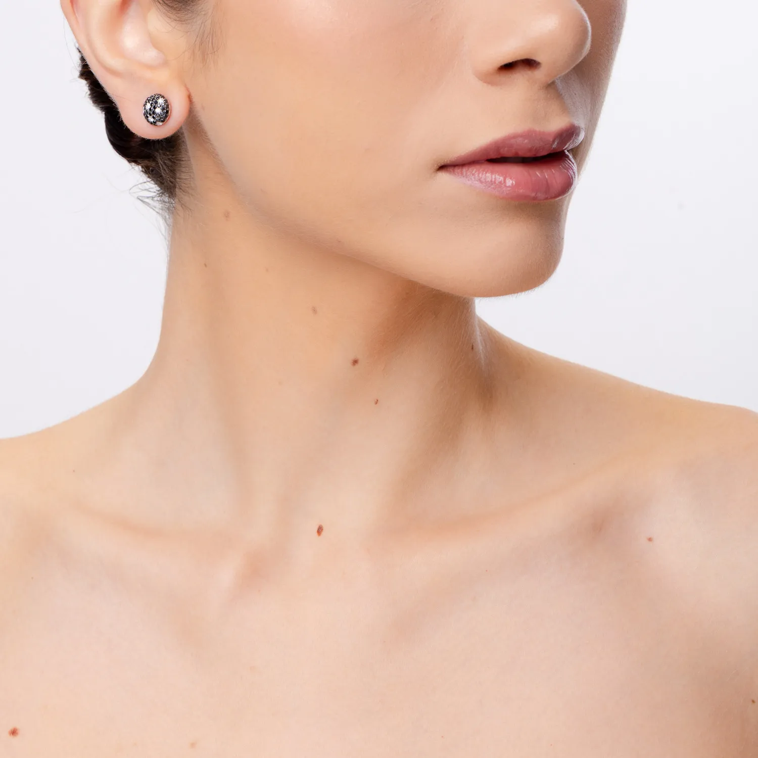 White gold stud earrings with 1.1ct black diamonds and 0.1ct clear diamonds
