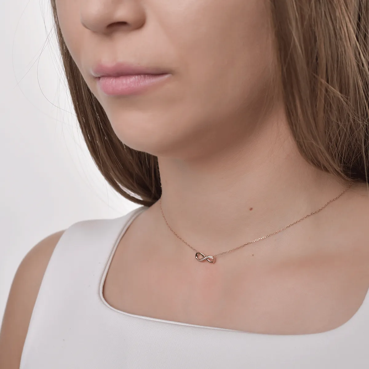 Rose gold infinity pendant necklace with 0.03ct diamonds