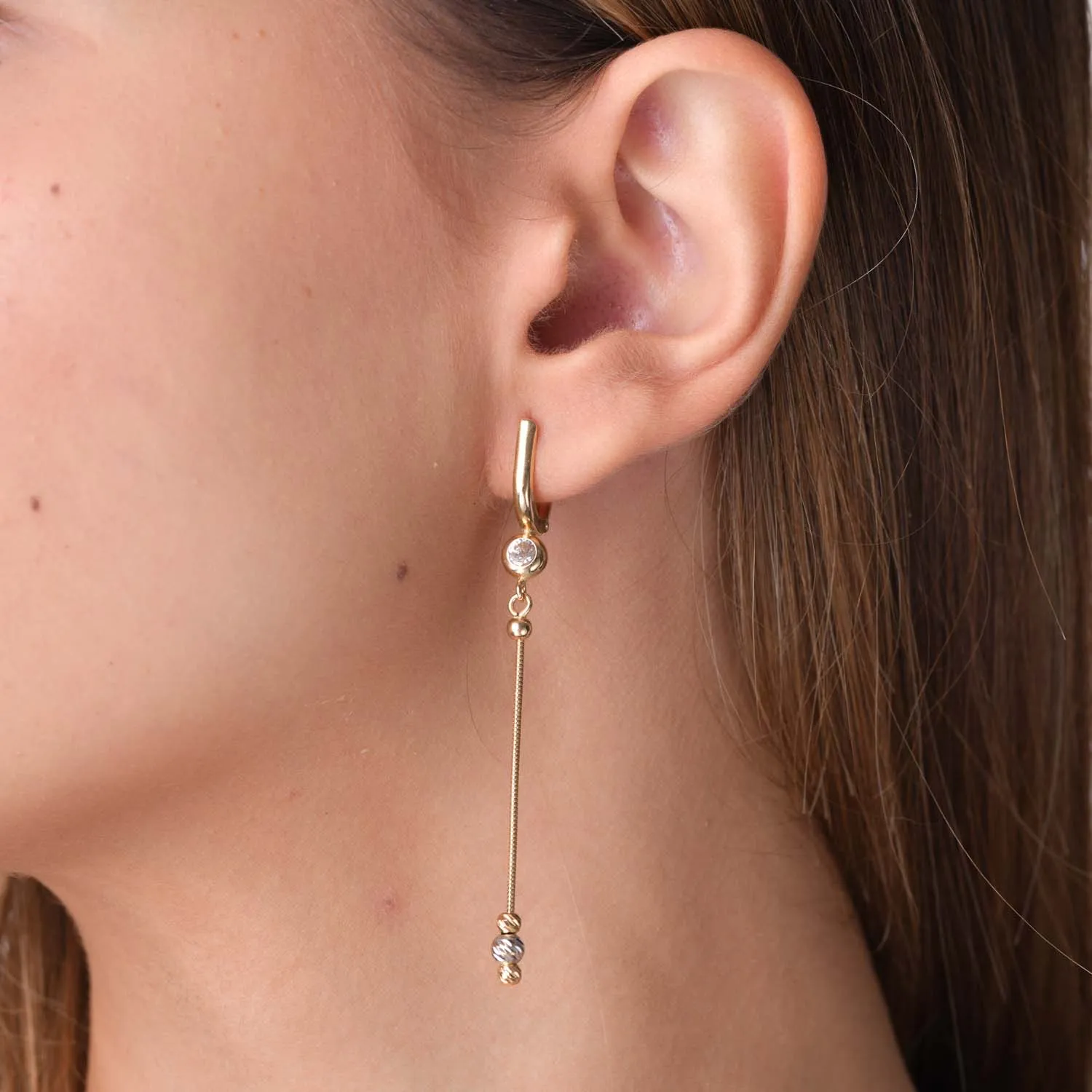 White-yellow gold long earrings with zirconia