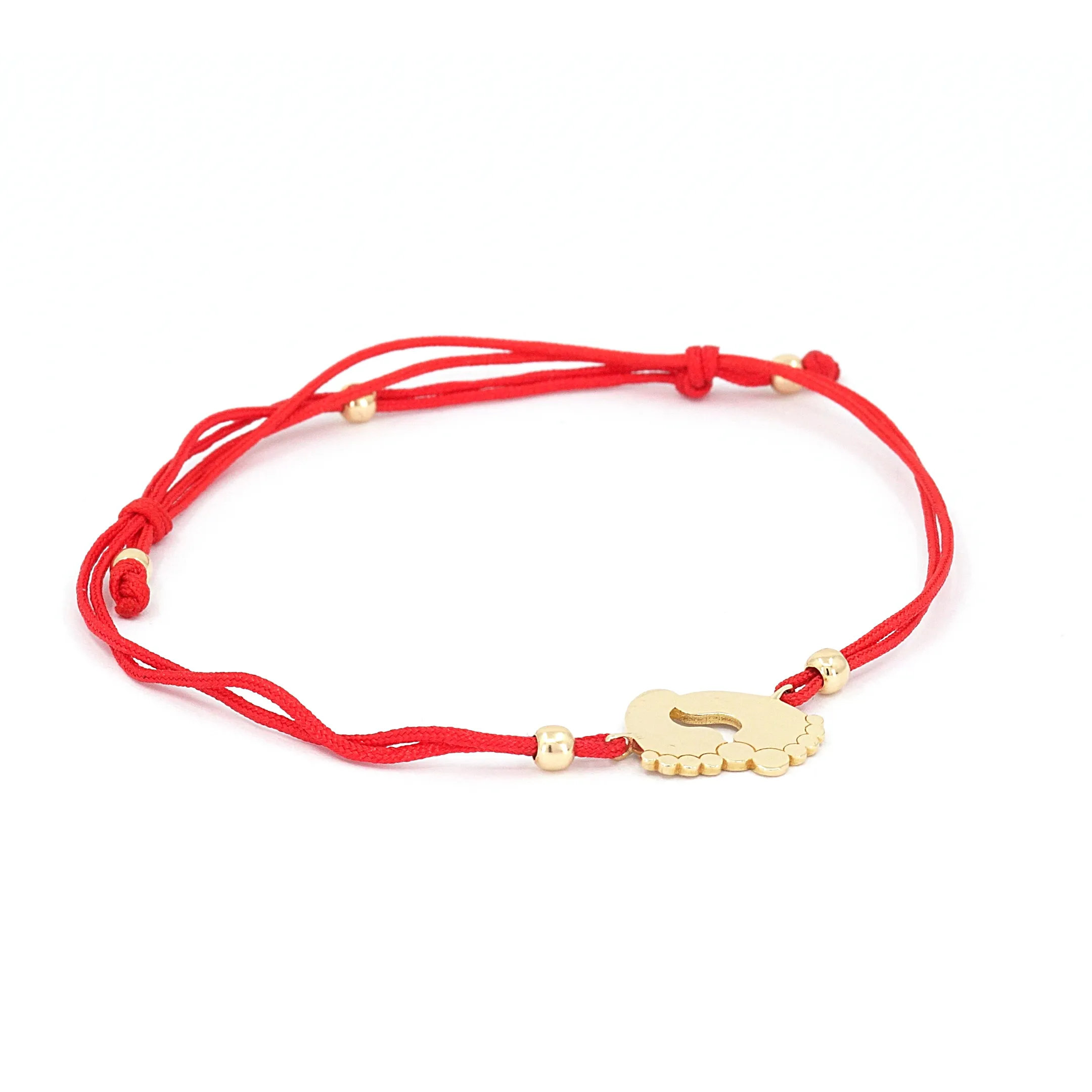 Red cord bracelet with 14K yellow gold baby feet charm