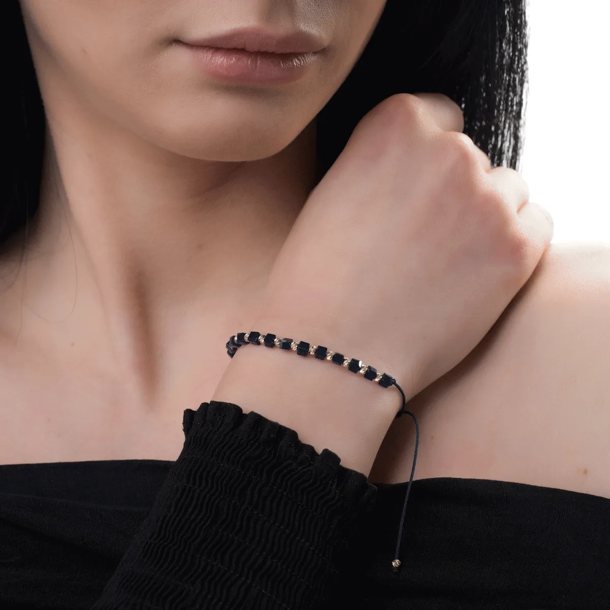 Blue cord bracelet with 14K yellow gold